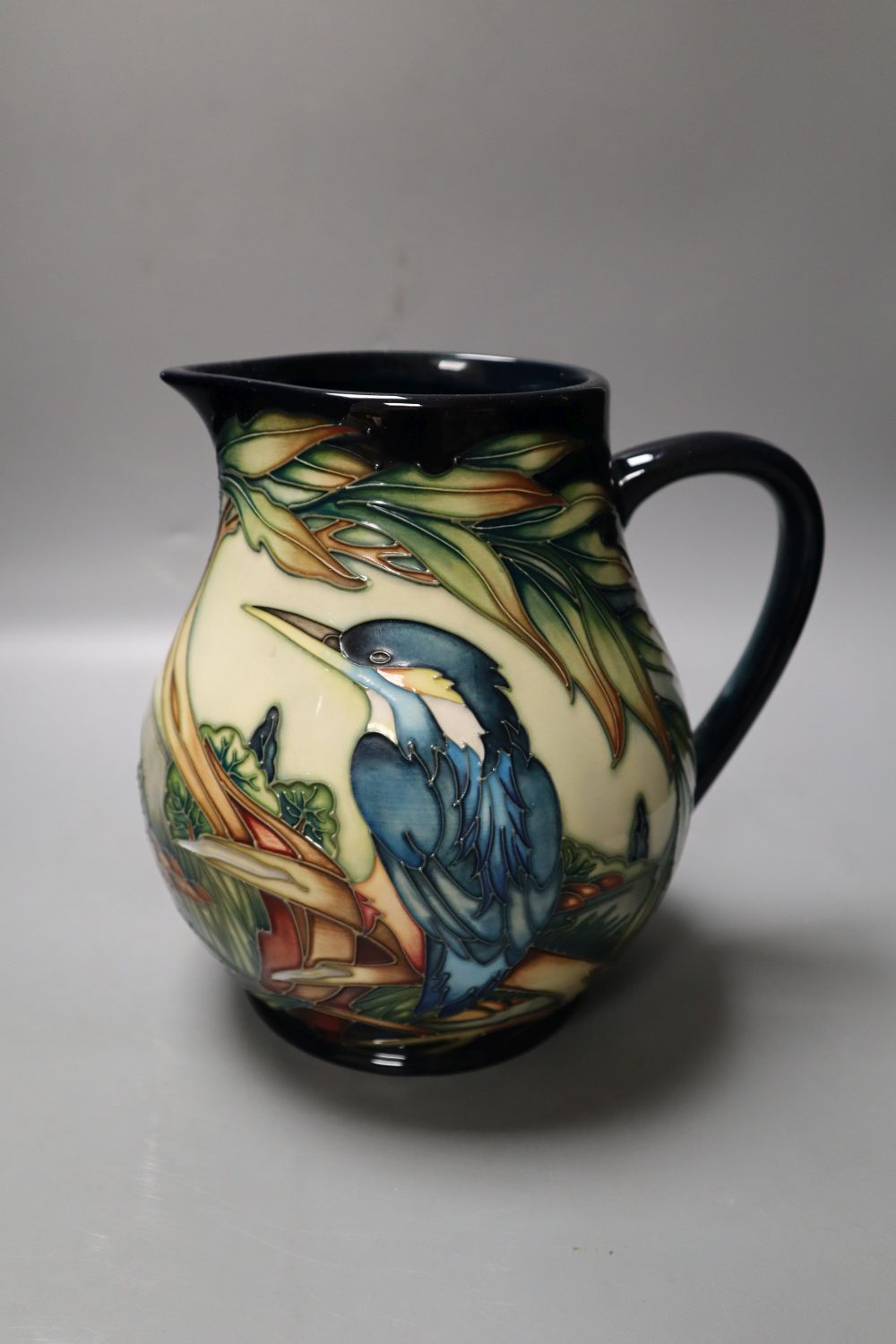 A Moorcroft jug, Kingfisher pattern, designed by Philip Gibson, Gibson, limited edition number 35 of 350, 19cms, together with orig